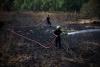 Two die as firefighting helicopters collide in Greece, French blaze changes course