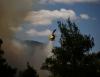 Two helicopters collide in Greece as fires spread