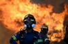 Two fire helicopters collide in Greece and two die as forces battle multiple wildfires