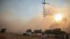 Two crew killed after firefighting helicopters collide in Greece, as British pilot survives