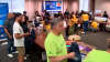 United Way Miami assemble backpacks for students and families needing back-to-school supplies