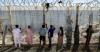 Moroccans gather at Ceuta border, desperate for news of loved ones