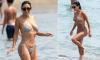 Eva Longoria, 51, is swimsuit season goals in itty bitty bikini as she splashes around the beaches of Spain
