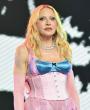 Madonna wows in a purple silk corset and matching bloomers for Amsterdam WorldPride performance