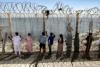 Moroccans gather at Ceuta border, desperate for news of loved