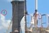 Naked nutjob jumps from Brooklyn Bridge after erecting flags
