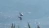 Two firefighting helicopters collide as Greece battles wildfires near Athens