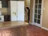 A “Lifeless” Kitchen Got a European-Style Redo with a Pink Island