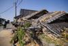 Prime minister visits quake-hit southern Japan as cleanup begins in intense heat