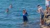Chaotic frontline of the Ceuta migrant invasion where young men swim for 6hrs in children’s rubber rings to reach Europe
