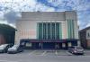 Drawings reveal how former cinema could be transformed into flats and retail unit