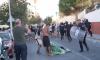 Huge mob of Moroccans chanting 'Allahu Akbar' clash with Spanish police after marching through Ceuta as enclave remains gripped by fear