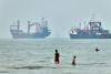 World Associated Press Cargo ship reports being struck in Strait of Hormuz as US, Iran claims about talks diverge
