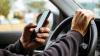 MPs raise concerns over mounted devices, private-hire drivers as law passed to criminalise holding phones while driving