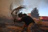 Water-Dropping Planes Battle Athens Wildfire As England Records Driest July On Record