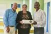 SVG EX Teachers present movie projector to J.P Eustace Memorial