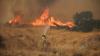 Firefighters face huge flames as they deal with wildfire near Athens