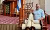 A retired judge needed four Torahs rescued from Indiana. So he called his rabbi. And his dentist.