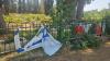 Israeli flags placed beside grave of fallen soldier torn, vandalized