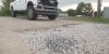‘I didn’t want this.’ Baton Rouge business owner stuck in regulatory loophole after crater left in driveway