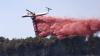 What is the red substance being dropped on wildfires in Europe?