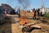 WHO chief says Ebola outbreak is outpacing response as aid workers strike over pay