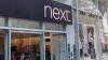 FTSE 100 movers: Next surges on guidance upgrades; Asia-focused banks hit