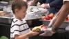 Brewers team up in Milwaukee's Merrill Park to serve meals to hometown kids