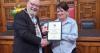 Former headteacher honoured for founding charity that helps children