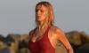 Brooks Nader perfects her Baywatch beach run as she slips into the iconic red swimsuit to shoot new scenes in Malibu