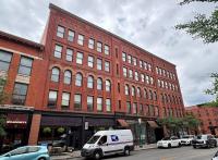 Former Syracuse basketball star owes city $500K for violations at downtown building