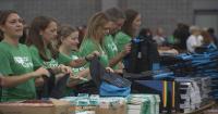 Over 750 volunteers pack school supplies for students in need