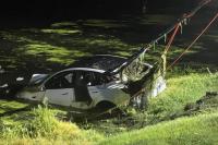 New Jersey driver escapes after Tesla plunges into pond