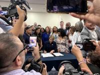 Healey signs sweeping immigrant protections into law