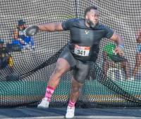 Wright wins discus, Moore grabs silver in 110-metre hurdles