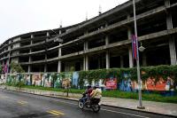 Khmer proverb: When Big Traders Tighten, the People Feel It