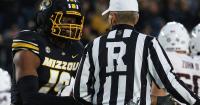 Missouri defensive end Darris Smith (19) protests a call with an official (copy)