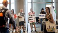 Immigrant advocates picket against immigrant detainee flights at Salt Lake airport
