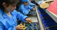 China's exports slow slightly despite big tech demand