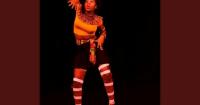 Teenager running dance workshops to teach children about African culture