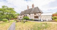 Merton cottage with wood-burning stoves and original features up for sale