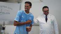 Manchester City's Tijjani Reijnders meets city centre cocktail bar team during South Korea visit