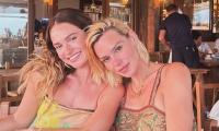 Lily James and Billie Piper wear co-ordinating camisole tops as they reunite for cosy holiday in Spain