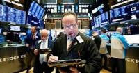 Tech surge powers Nasdaq higher as Wall Street closes week on upbeat note
