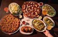 La Merna Serves Chicago-Style Tavern Pizza in a Nostalgic Wood-Paneled Space