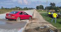 Wisconsin driver ignores 'road closed' sign, pulls into fresh concrete