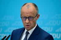 Storm 1516 Hits Merz With Stolen Deutsche Welle Logo in European Leader Blitz