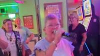 Karaoke singer 'Sweetcheeks Lozza' belts out Crazy Frog in 'most British pub video ever'
