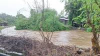 Clogged Ilocos Sur river almost overflows amid heavy rains