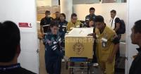 Family and friends of Thai shooting victims collect bodies from Bangkok morgue